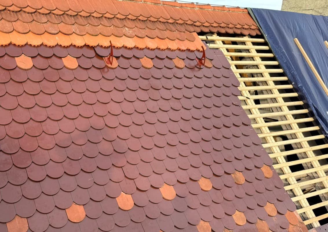 Close view of a tiled roof being renovated